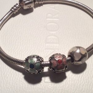 Pandora bracelet with three Pandora charms